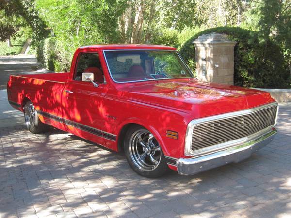 Brightly shining red 1969 Chevrolet C-10 1/2 Ton Long Bed Retro rod